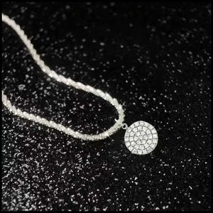 Zircon round pendant necklace in silver with shimmering stones on a delicate chain