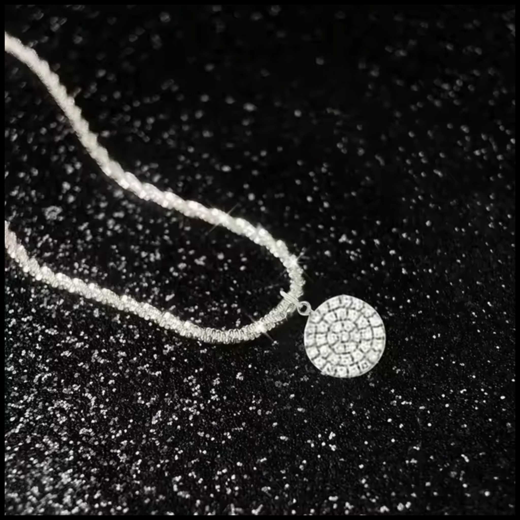 Zircon round pendant necklace in silver with shimmering stones on a delicate chain