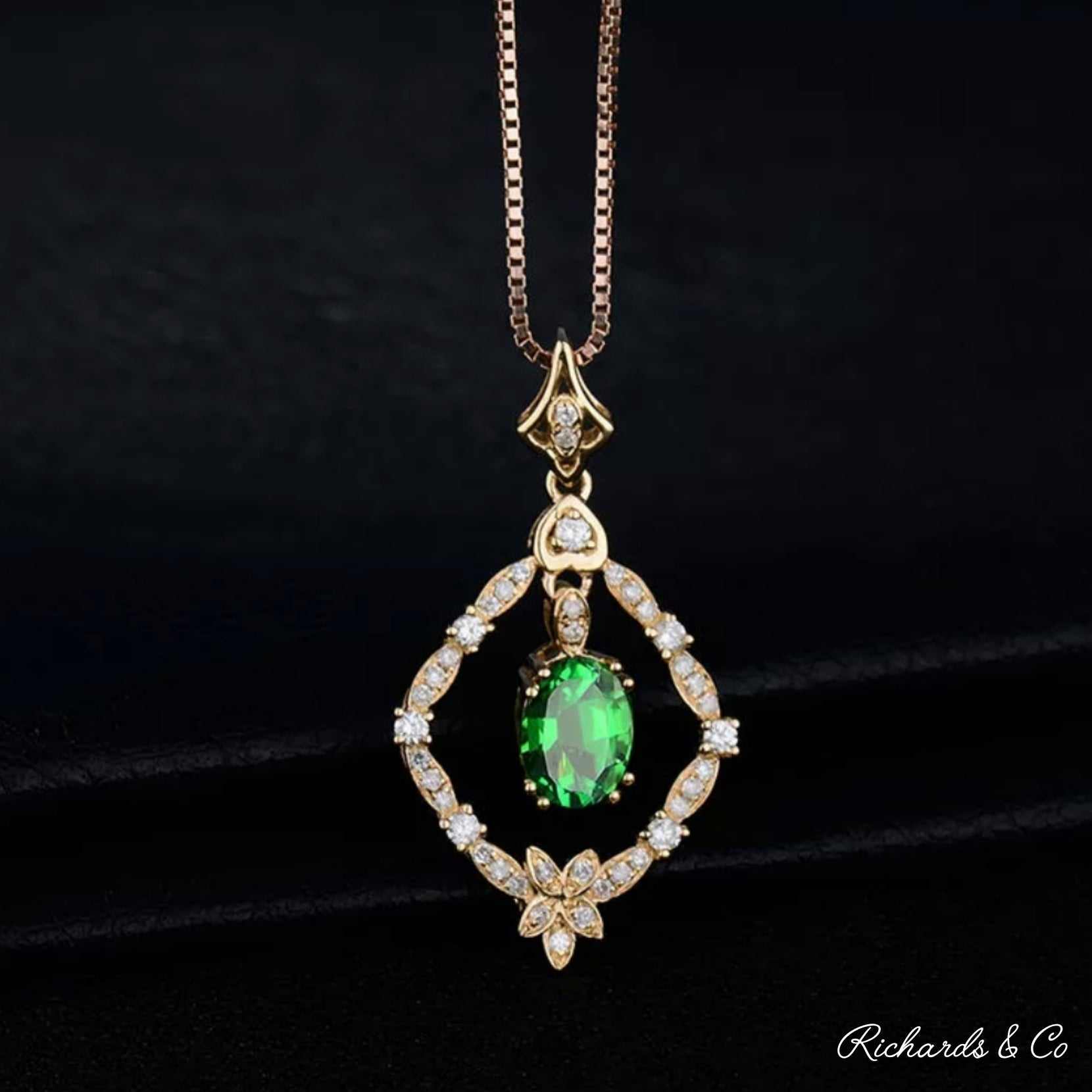 18K yellow gold Diamonds & Tsavorite pendant with oval green tsavorite and round white diamonds on chain