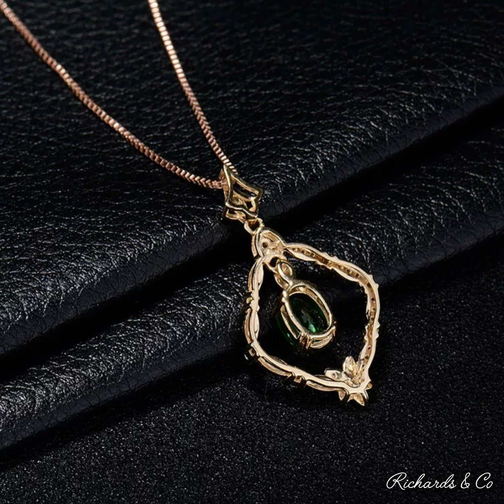 18K yellow gold Diamonds & Tsavorite pendant with oval green tsavorite garnet and surrounding sparkling diamonds on a chain