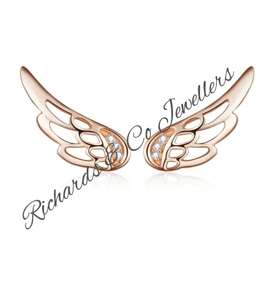 Silver Zircon sterling silver wing earrings with zircon stones and push back closure