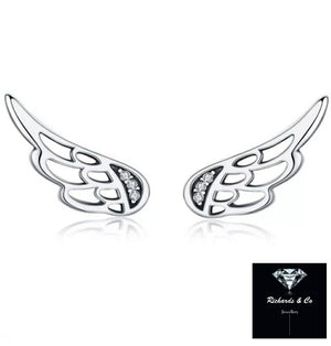 Silver Zircon sterling silver wing earrings with cubic zirconia stones, elegant and lightweight celestial jewelry.