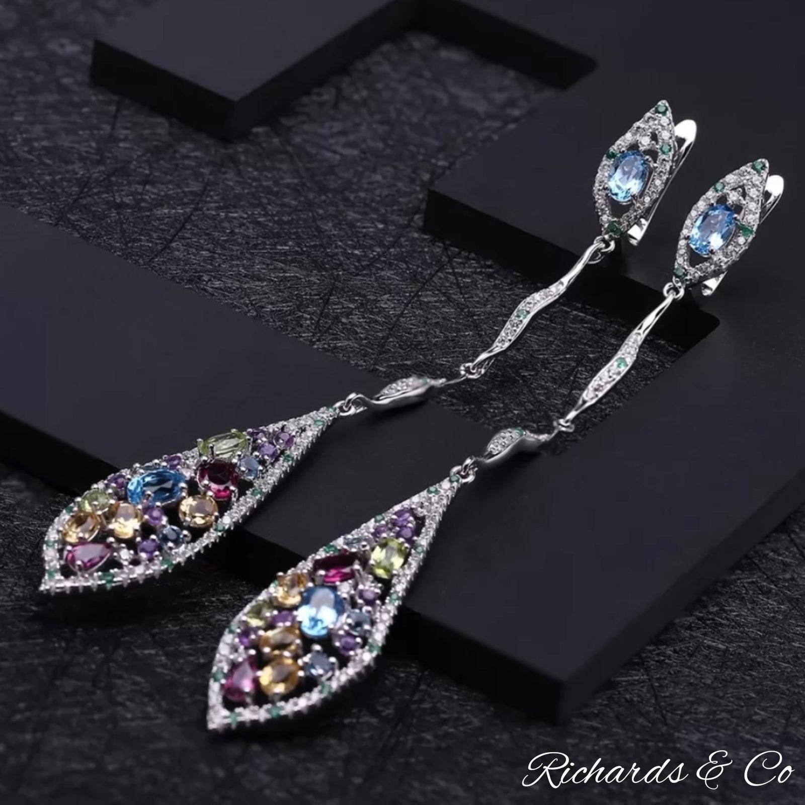Multi-colour silver long drop earrings with natural gemstones including garnet, peridot, citrine, topaz, amethyst, emerald, and white CZ