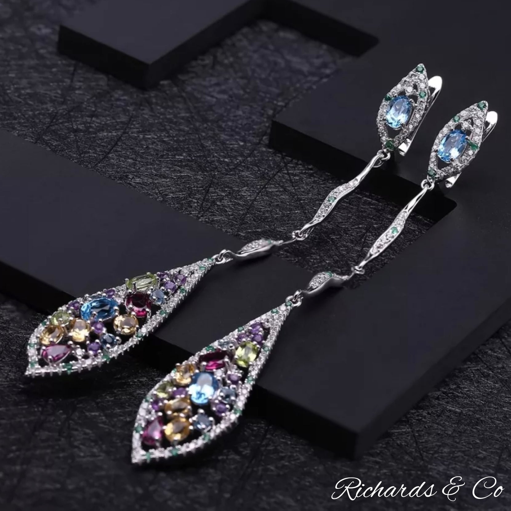Multi-colour silver long drop earrings with natural gemstones including garnet, peridot, citrine, topaz, amethyst, emerald, and white CZ