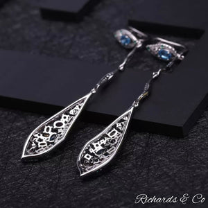 Long drop silver earrings with multi-colour natural gemstones including Swiss blue topaz and emerald accents