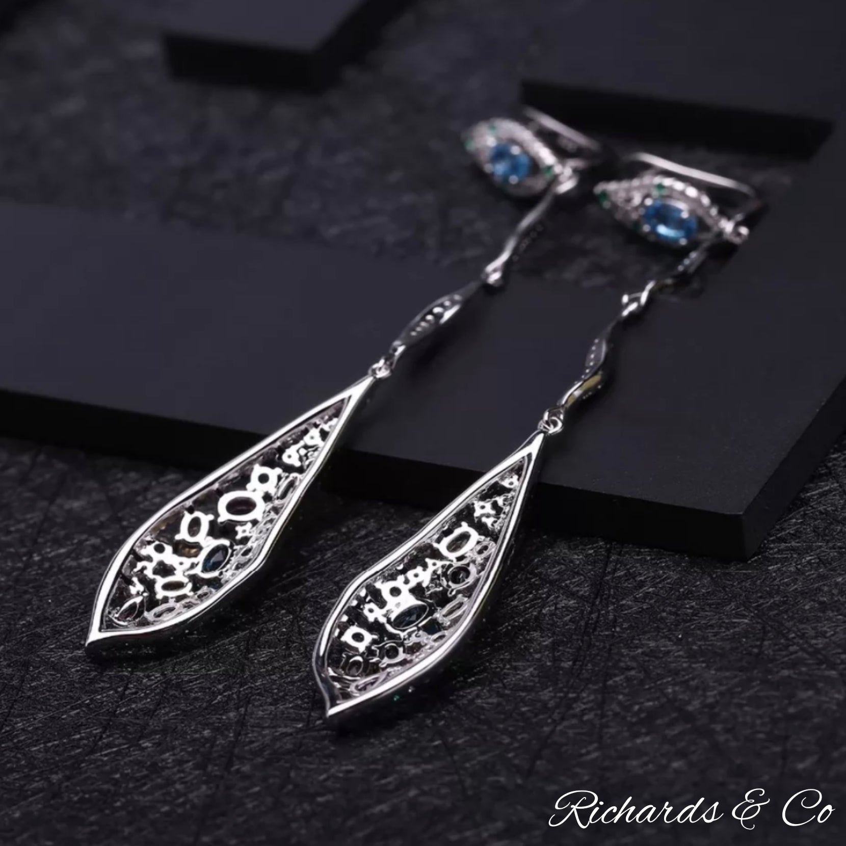 Long drop silver earrings with multi-colour natural gemstones including Swiss blue topaz and emerald accents
