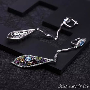 Long drop silver earrings with multi-colour natural gemstones including garnet, peridot, citrine, topaz, amethyst, emerald, and white CZ