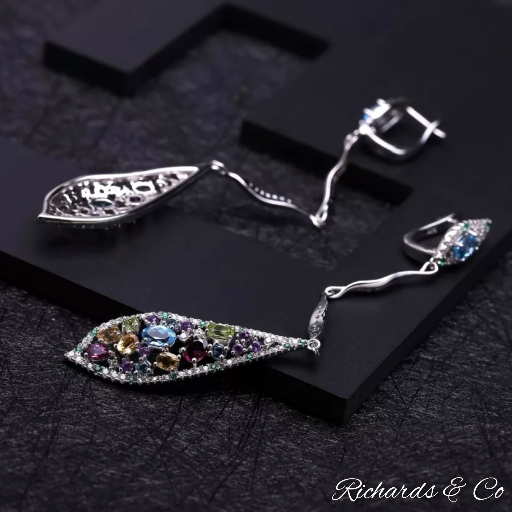 Long drop silver earrings with multi-colour natural gemstones including garnet, peridot, citrine, topaz, amethyst, emerald, and white CZ