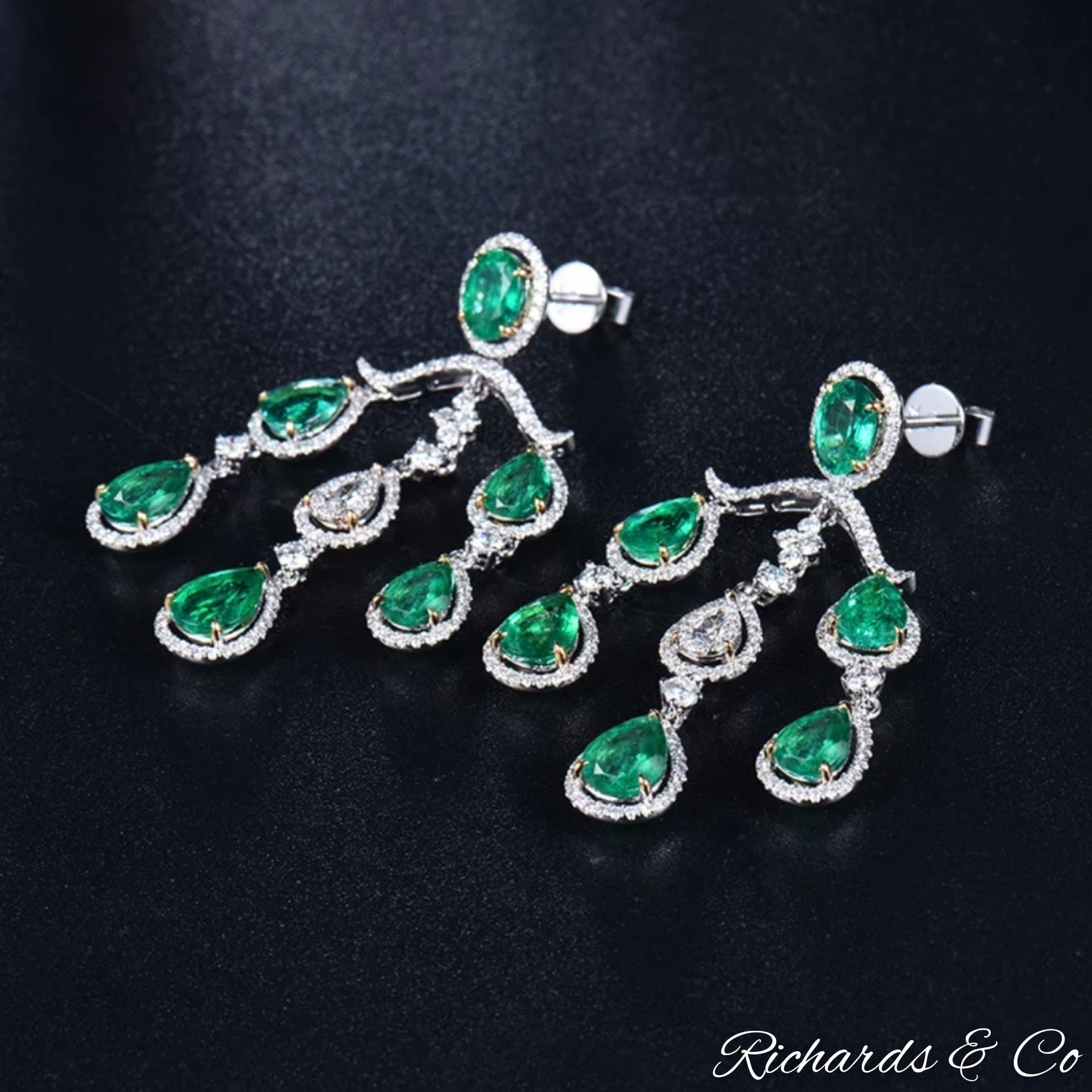 High end luxury white gold earrings with natural emeralds and diamonds, handcrafted chandelier style jewelry