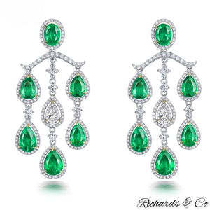 High end luxury earrings with natural emeralds and diamonds in solid 18K white gold chandelier design
