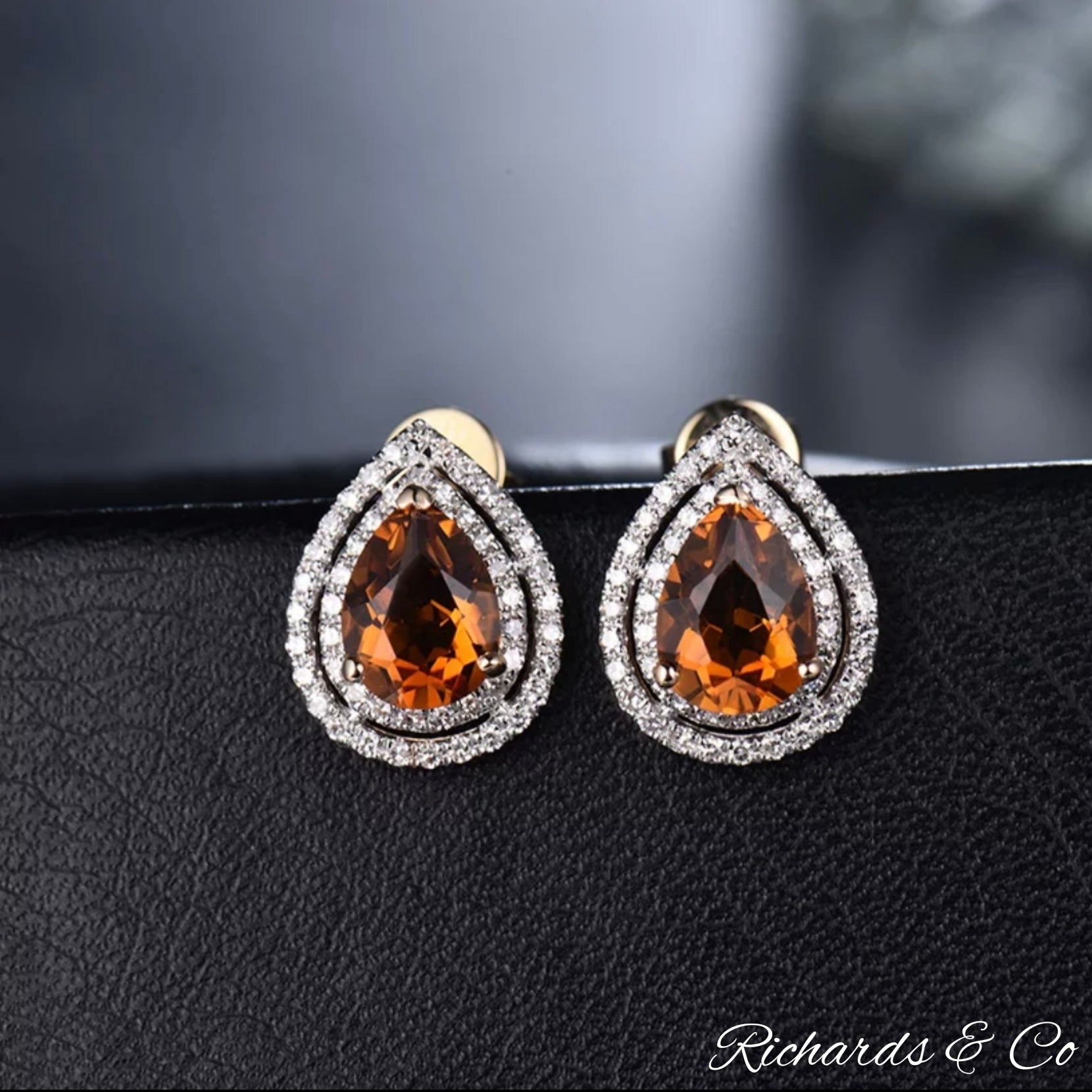 Pair of handcrafted 14K yellow gold AUTUMN earrings with pear-cut natural citrine and surrounded by sparkling diamonds.