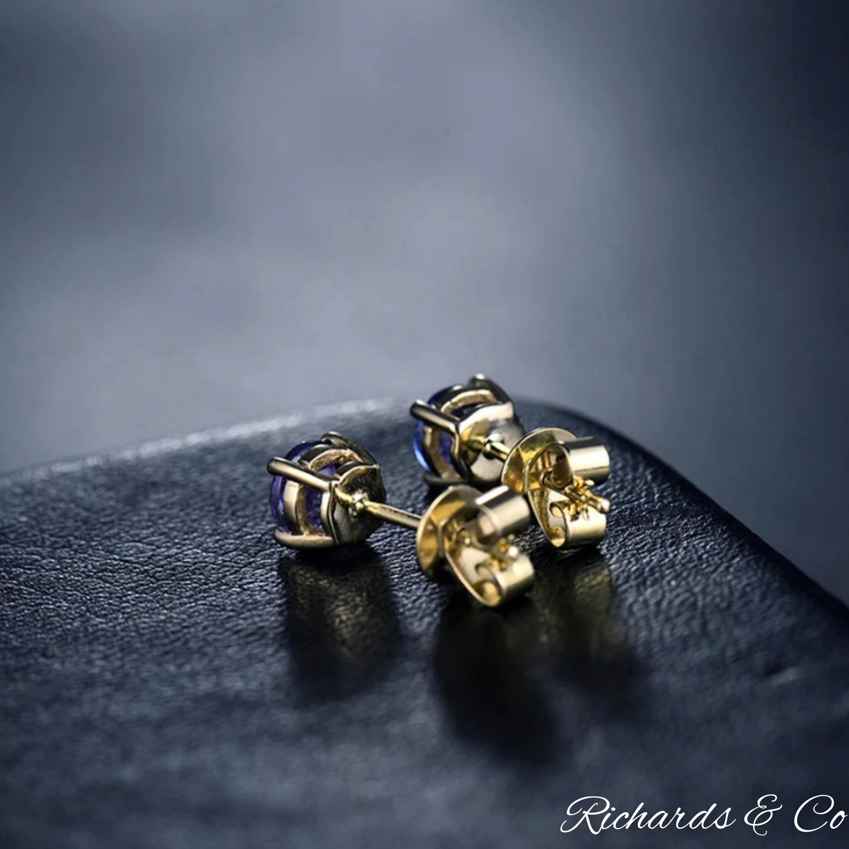 Natural Tanzanite stud earrings in 14K yellow gold with round 5mm violet-blue gemstones