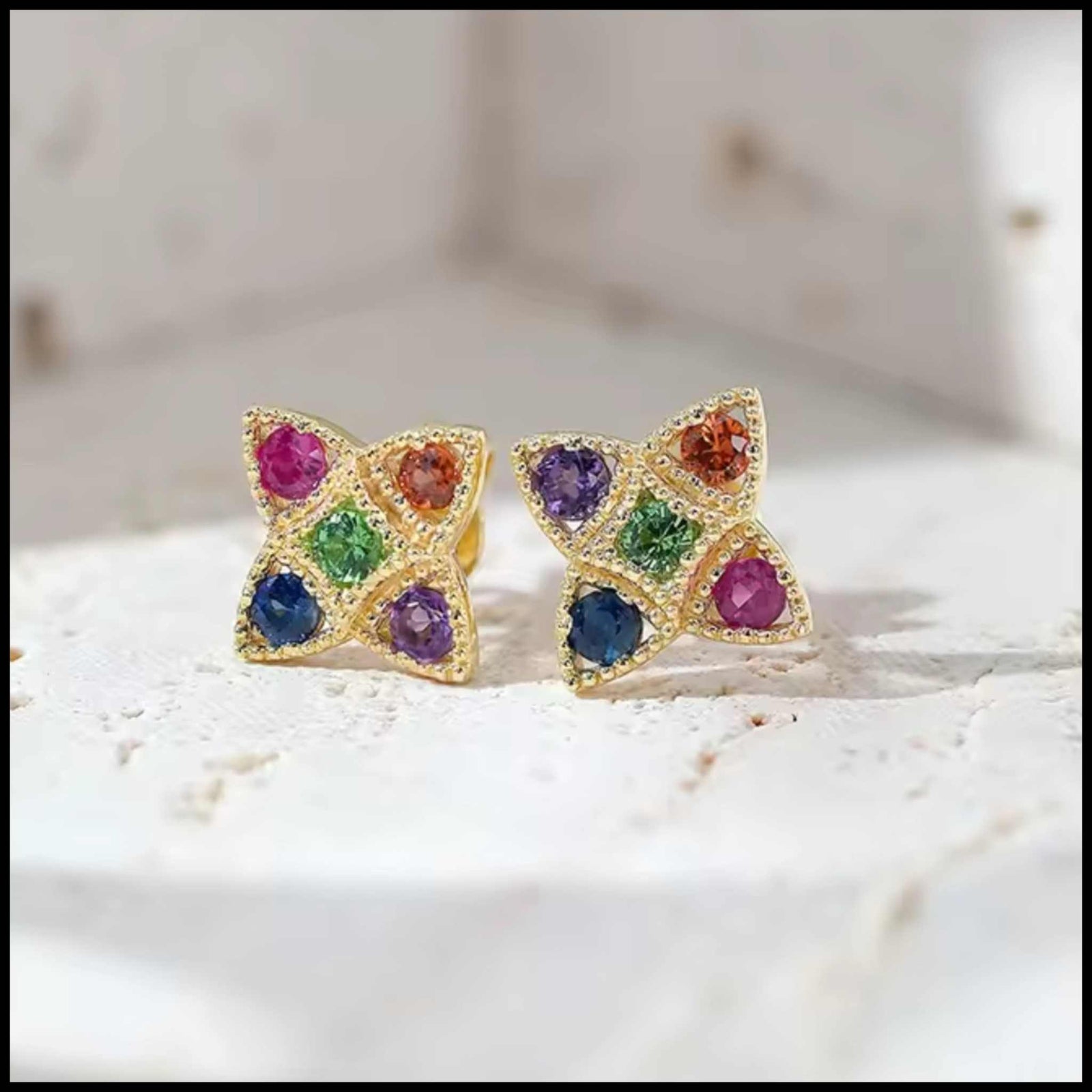 14k yellow gold multi gem earrings with ruby, amethyst, green garnet, blue sapphire, and orange sapphire studs