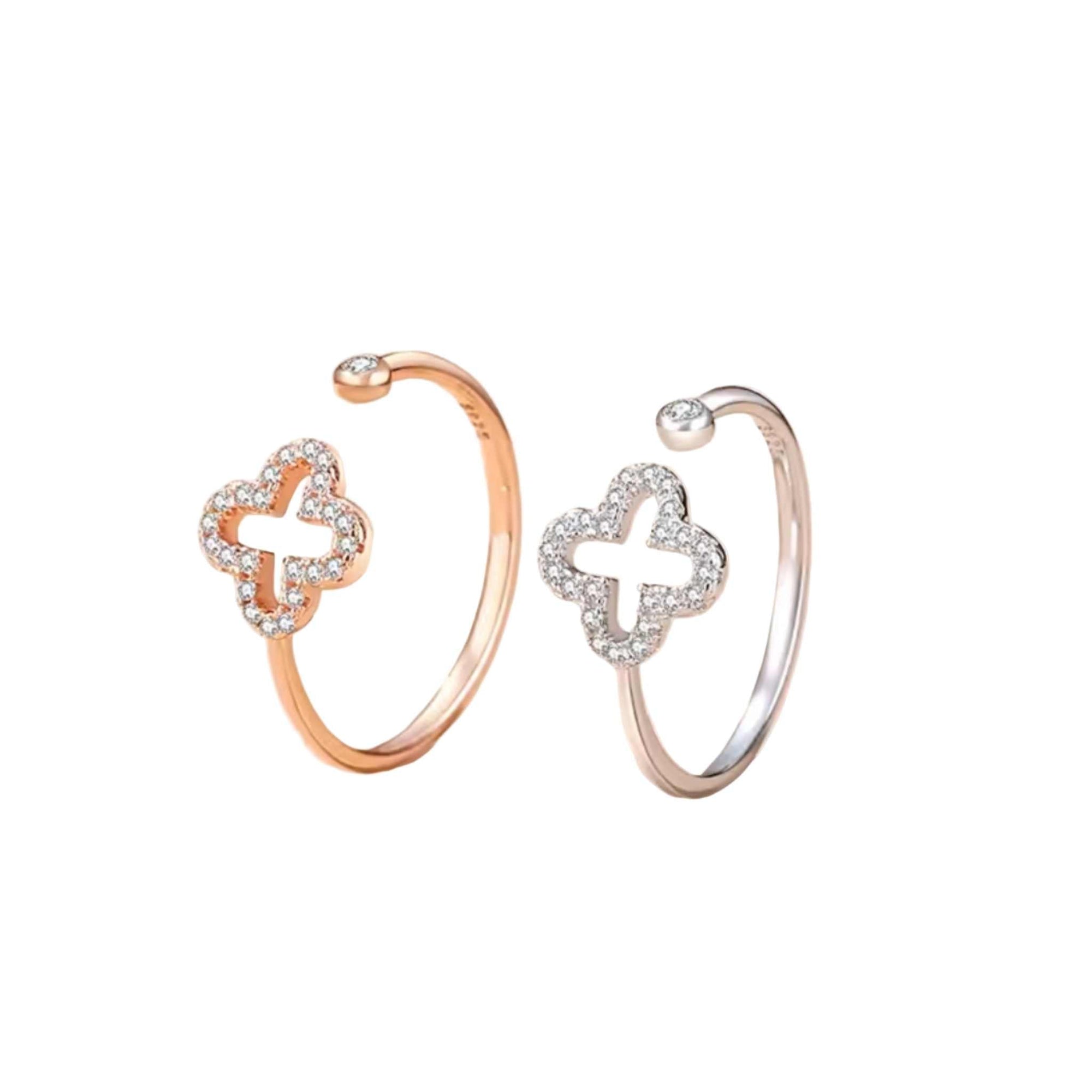 Adjustable four-leaf clover rings in solid silver and rose gold with sparkling cubic zirconia stones