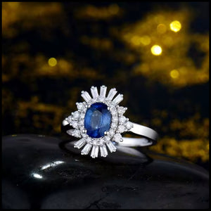Sapphire & diamond 18K white gold ring with oval blue sapphire and baguette diamonds