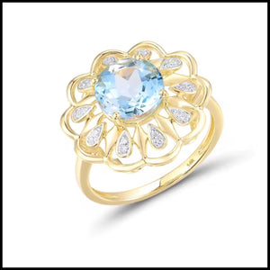Flower Blue Topaz & Diamond Ring in 14k yellow gold with a 2.61ct sky blue topaz center and diamond accents