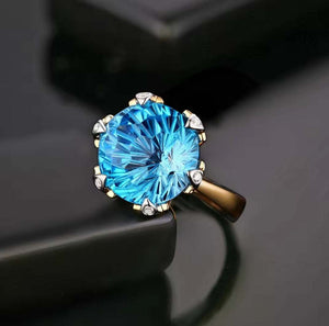 R and C Signature Piece ring with 9.68ct round blue topaz and diamond accents in 14K white and yellow gold pavé setting