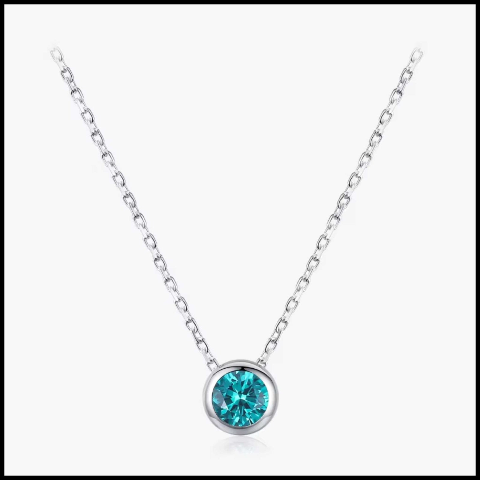 Blue cubic zirconia pendant necklace with solid silver chain and bezel setting