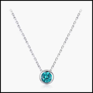 Blue cubic zirconia pendant necklace with solid silver chain and bezel setting