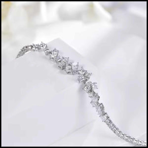 Diamond bracelet with clear stones on a white satin background