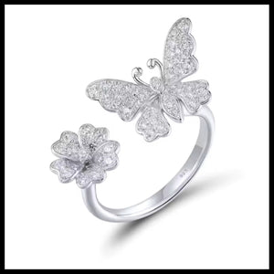 Silver butterfly and flower ring on a white background
