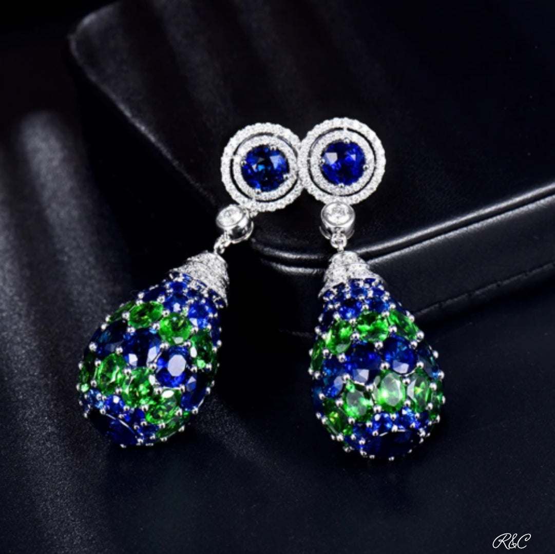CHRISTINE Diamond Earrings in 18K white gold featuring blue sapphires, green tsavorites, and sparkling diamonds