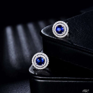 CHRISTINE Diamond Earrings in 18K white gold with sapphire center and diamond halo