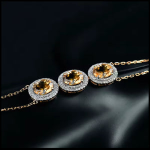 Citrine Diamond Three-Stone Gold Bracelet with oval citrine and diamond halo on double chain