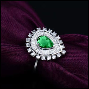 Pear-cut natural emerald and diamond ring in 18k white gold from Clarity Collection