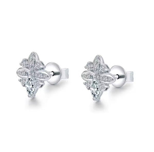 A pair of white gold stud earrings with a floral - clover-like design set with clear diamond gemstones, shown on a clean white background.