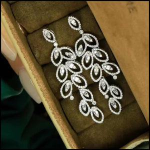 Diamond long drop earrings.