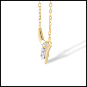 Gold necklace with a unique pendant on a white background