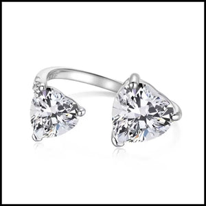Double Heart Adjustable Silver Ring with sparkling heart-shaped stones on an open band design