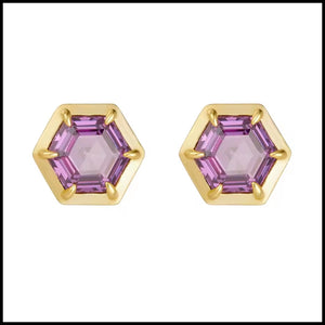 Hexagonal purple gemstone earrings with gold setting on a white background