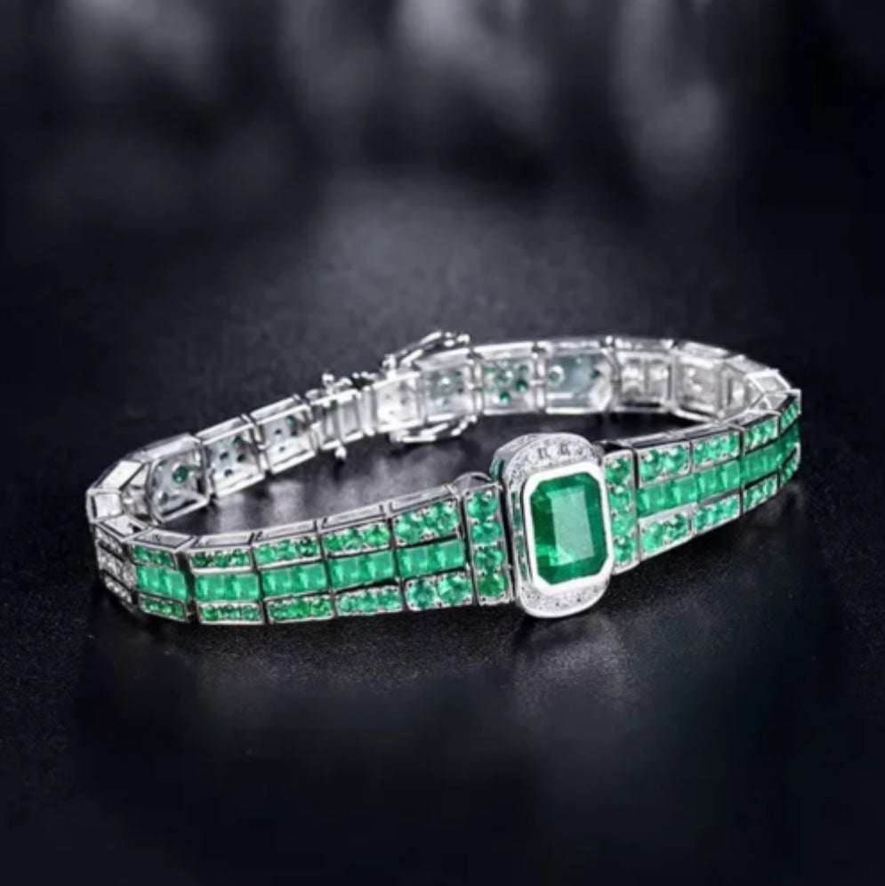 ARABELLA Emerald & Diamond Bracelet with solid 18K white gold, natural emeralds, and flawless diamonds in princess and emerald cuts.