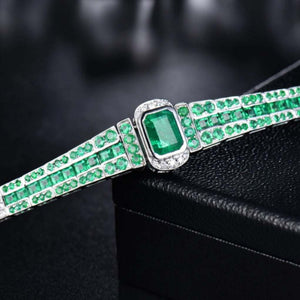 ARABELLA Emerald & Diamond Bracelet in 18K white gold with emerald cut emeralds and princess cut diamonds.