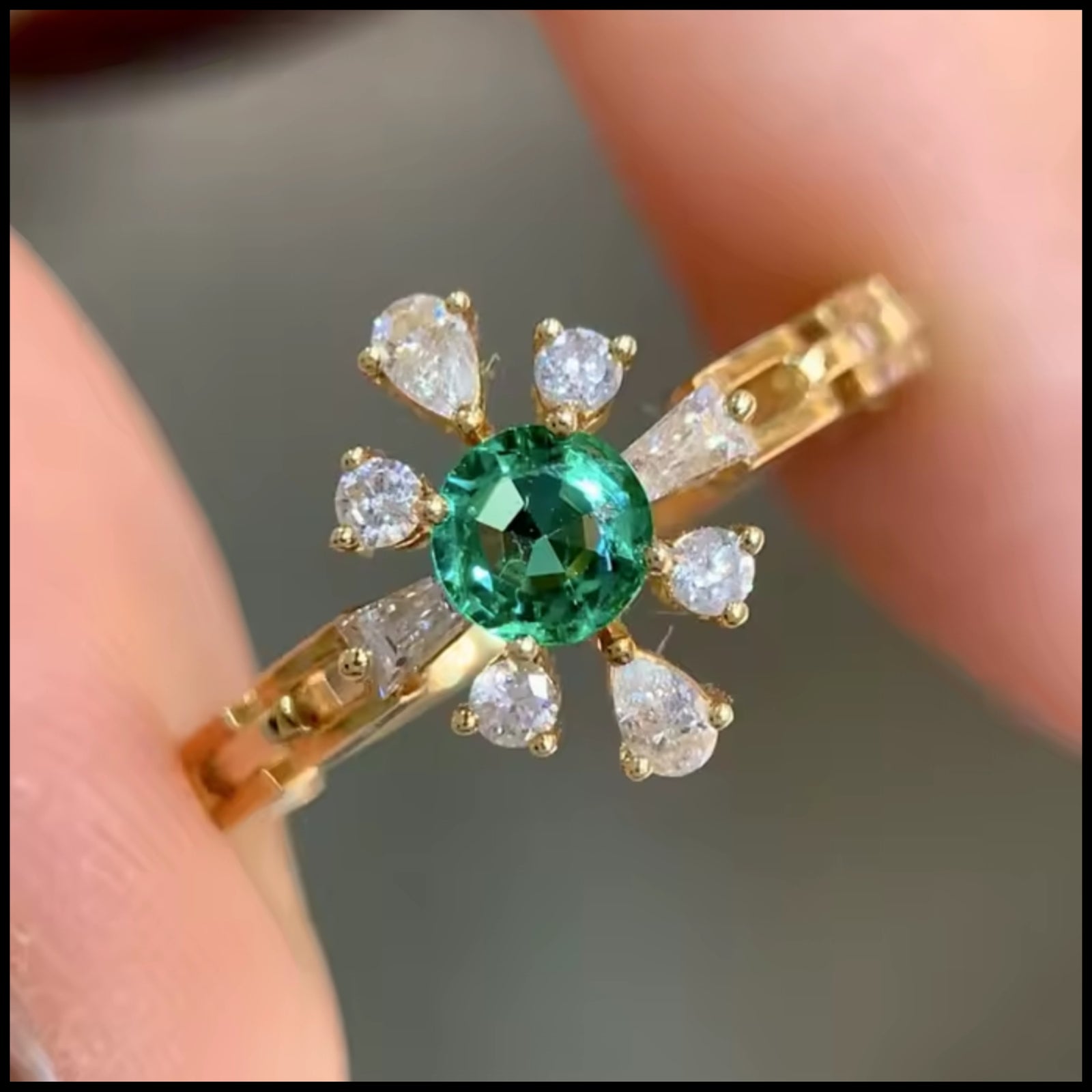 Close up picture emerald & diamond ring