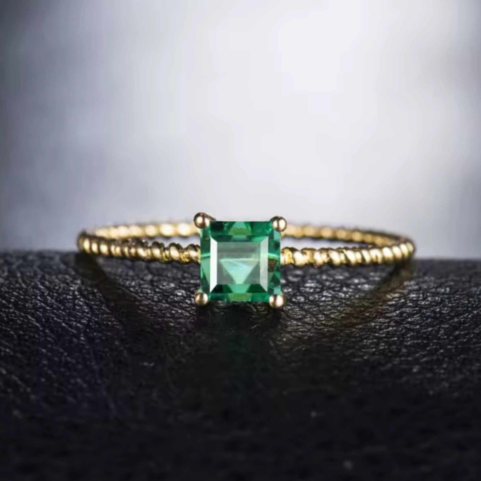 Emerald princess cut 18K gold vintage ring with 0.62-carat natural emerald centerpiece on textured band