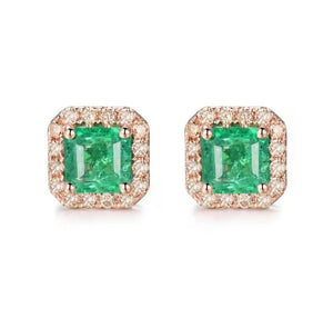 A pair of square halo stud earrings featuring vibrant green emerald-cut center stones surrounded by small clear pavé-set stones in a rose gold setting, shown on a plain white background.