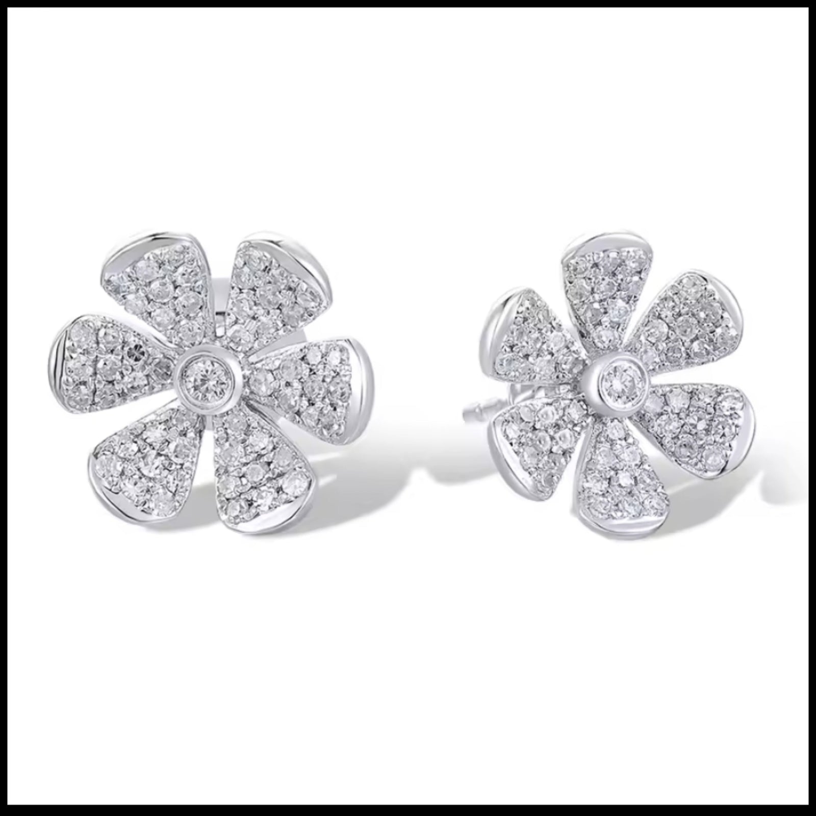14k white gold flower diamond earrings with 110 natural diamonds totaling 0.25ct in floral design, 9mm x 10mm studs.