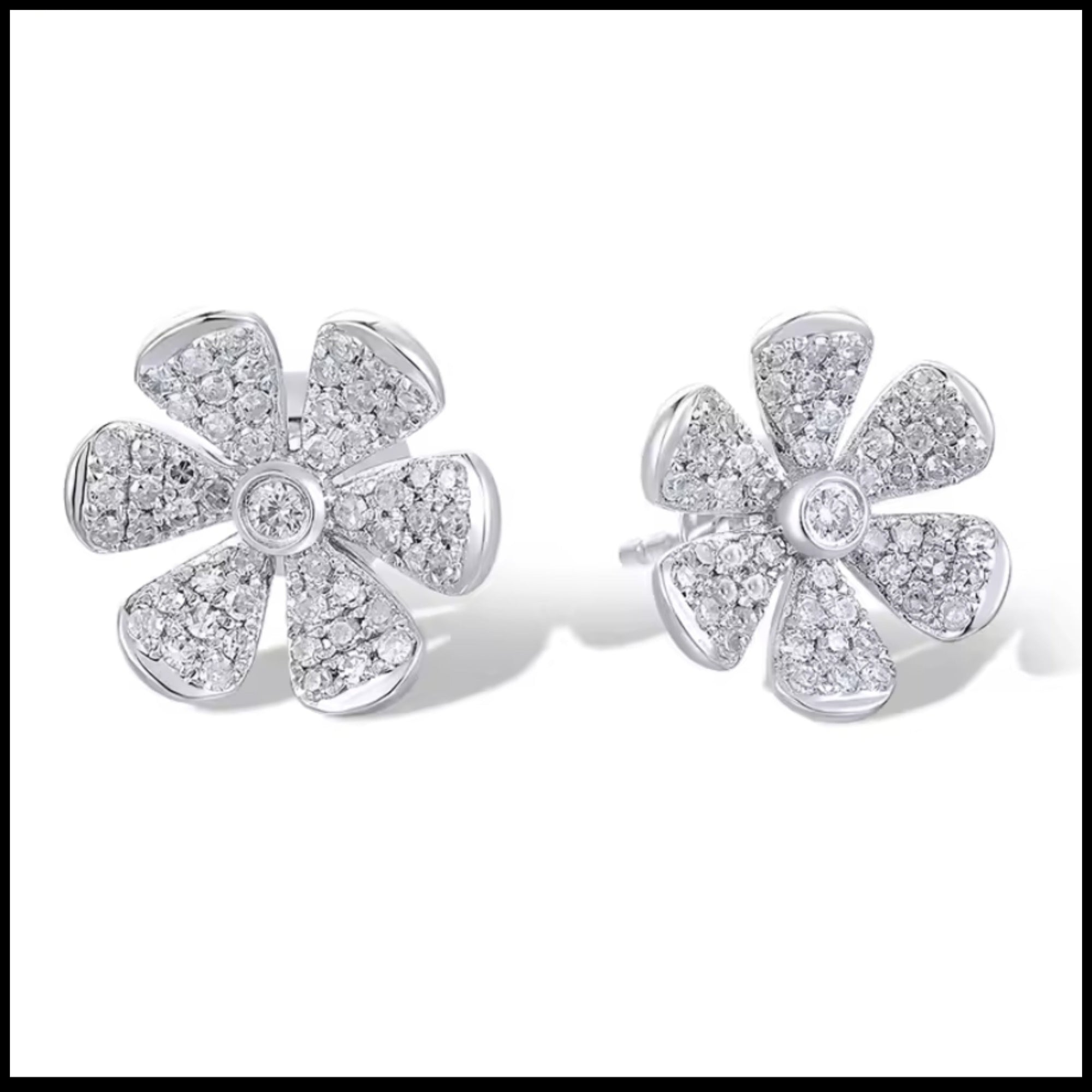 14k white gold flower diamond earrings with 110 natural diamonds totaling 0.25ct in floral design, 9mm x 10mm studs.