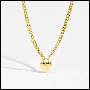 Gold heart-shaped pendant necklace on a white background