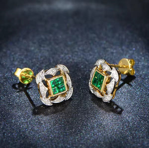 Emerald Diamond 18k Yellow Gold Earrings with rectangular green emeralds, round diamond accents, and sculpted gold settings.