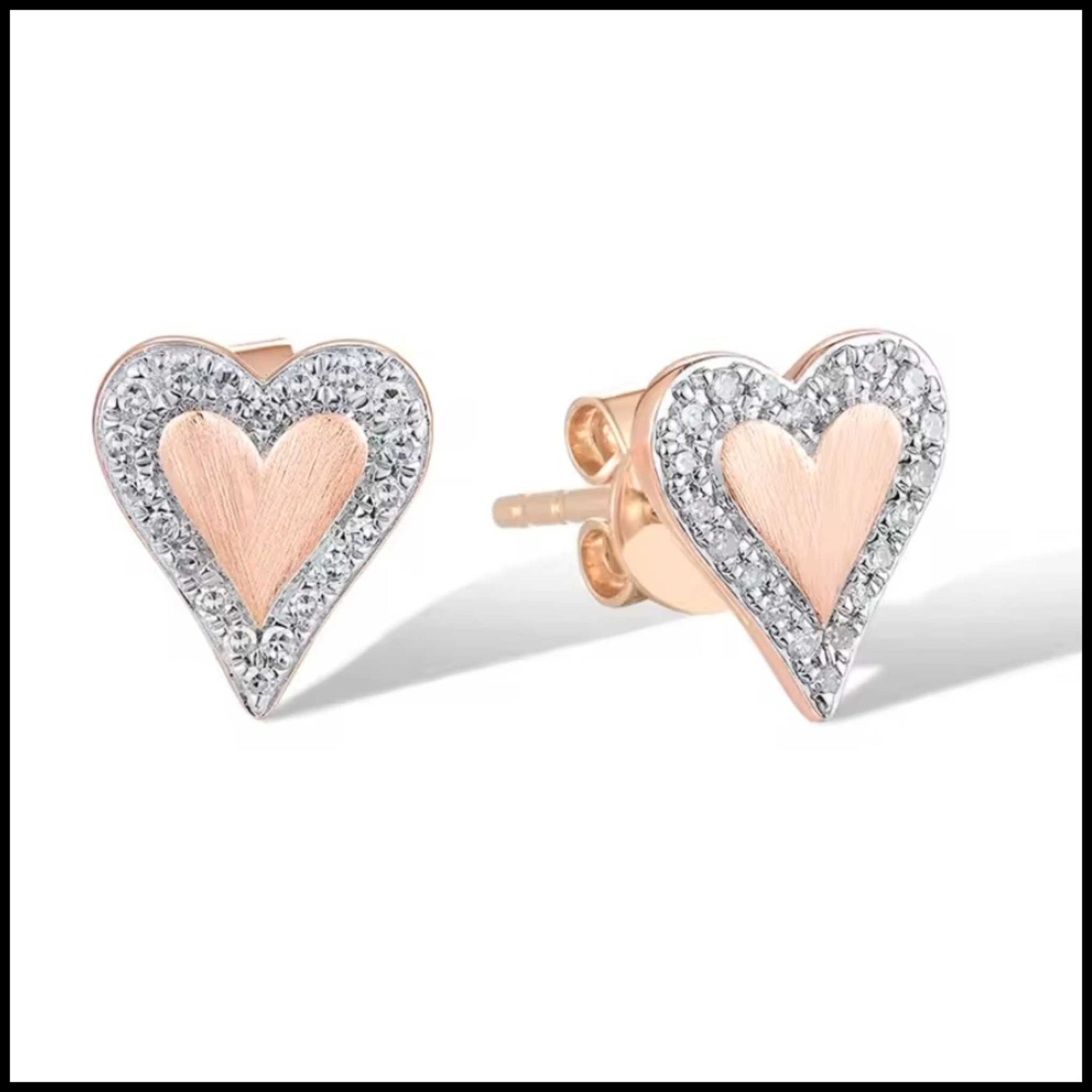 Heart-shaped earrings with rose gold and clear gemstone details on a white background