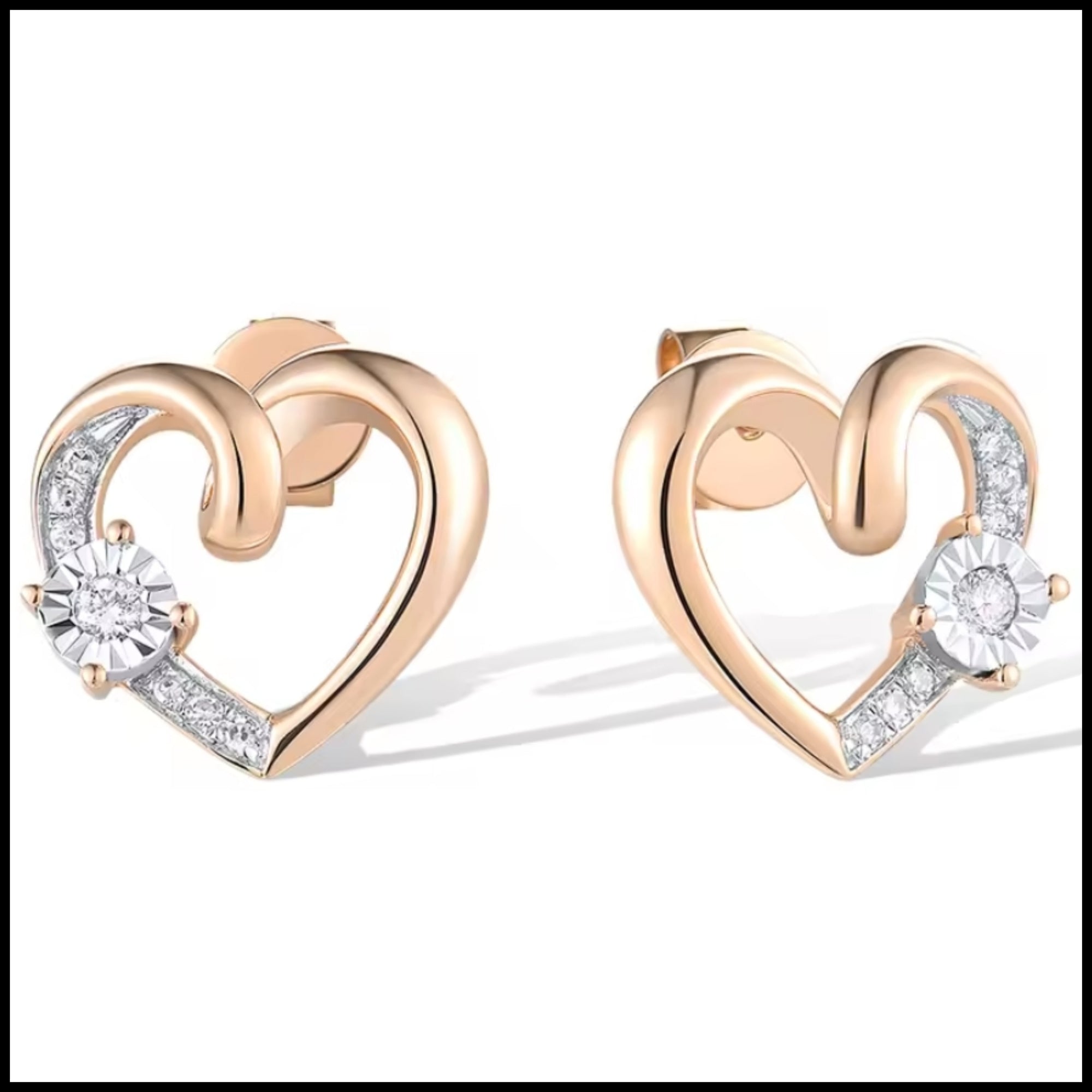 Rose gold heart-shaped earrings with clear diamond gemstones on a white background