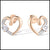 Rose gold heart-shaped earrings with clear diamond gemstones on a white background
