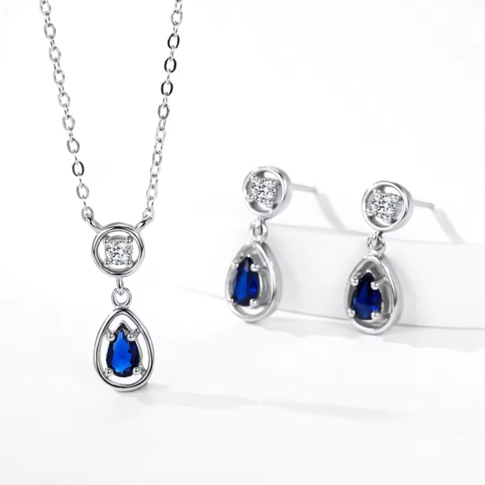 Blue Zirconia Silver Jewellery Set with water drop design necklace and earrings featuring blue and white cubic zirconia stones