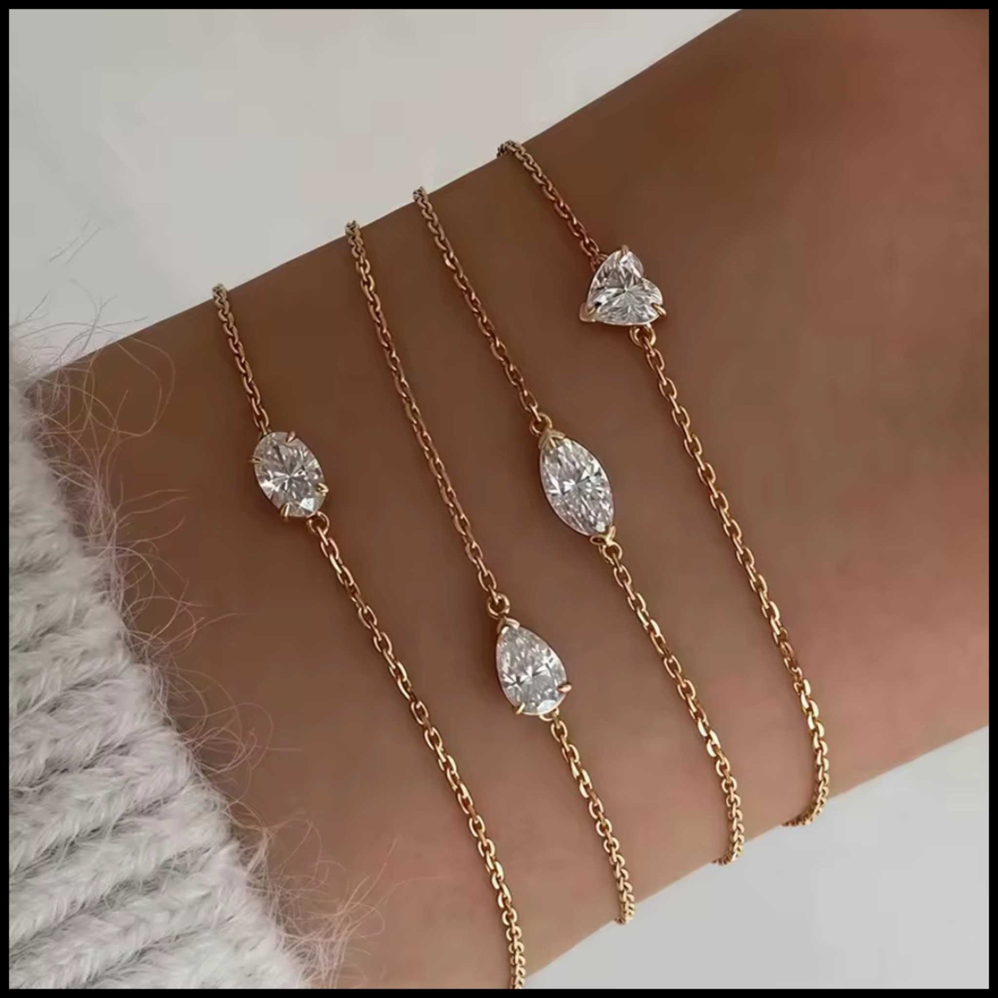 Moissanite chain bracelets in 18k gold plating with pear, marquise, heart, and oval cut stones on wrist
