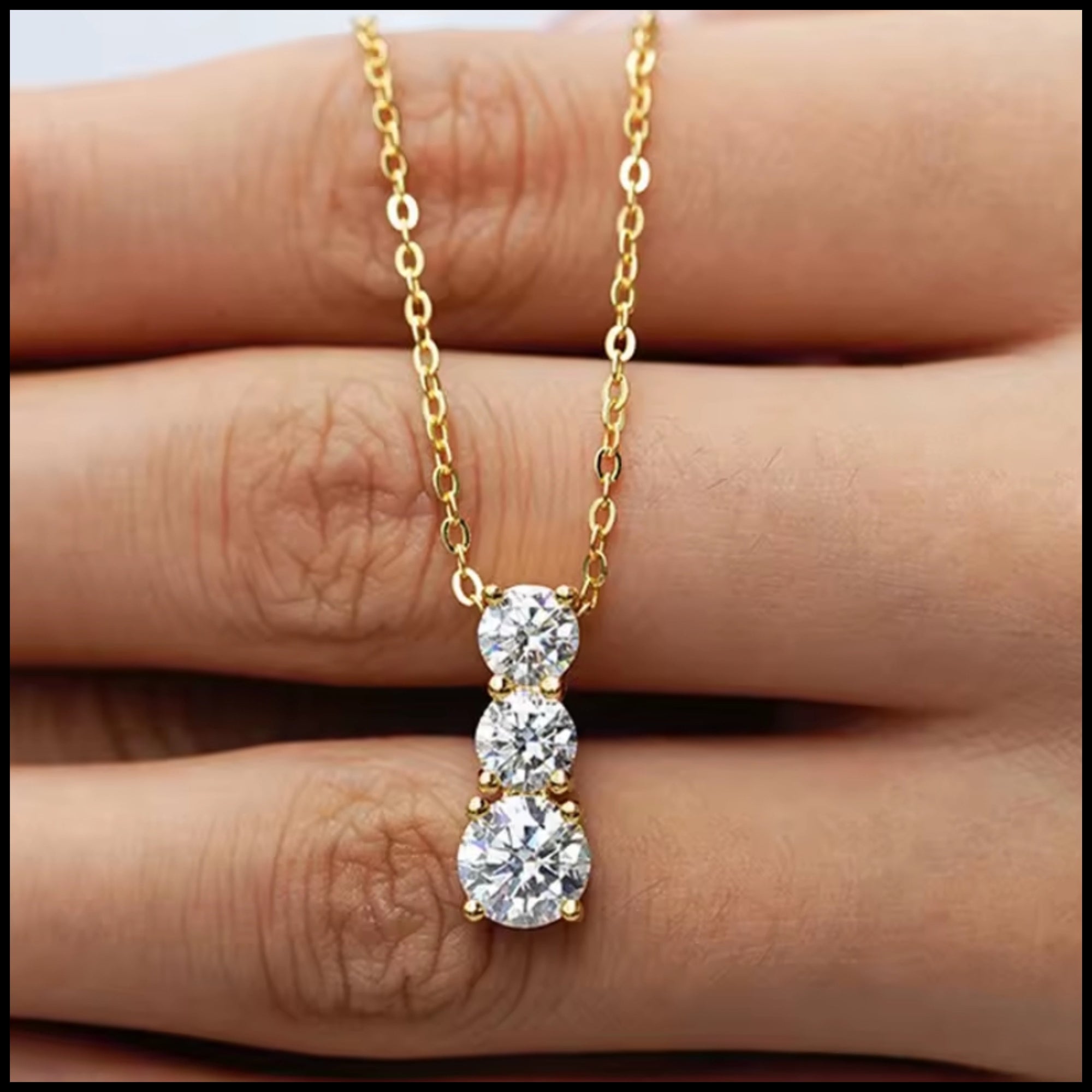 Three-stone moissanite necklace with 2 carats set in gold-plated silver chain