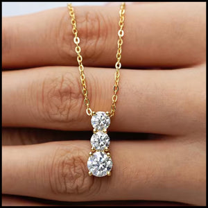 Three-stone moissanite necklace with 2 carats set in gold-plated silver chain